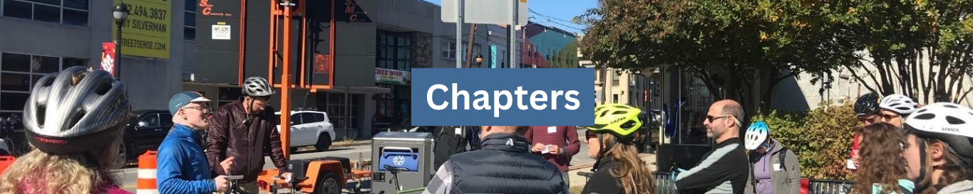 Photo featuring bikers stopped on a sidewalk talking, with a text overlay that says Chapters